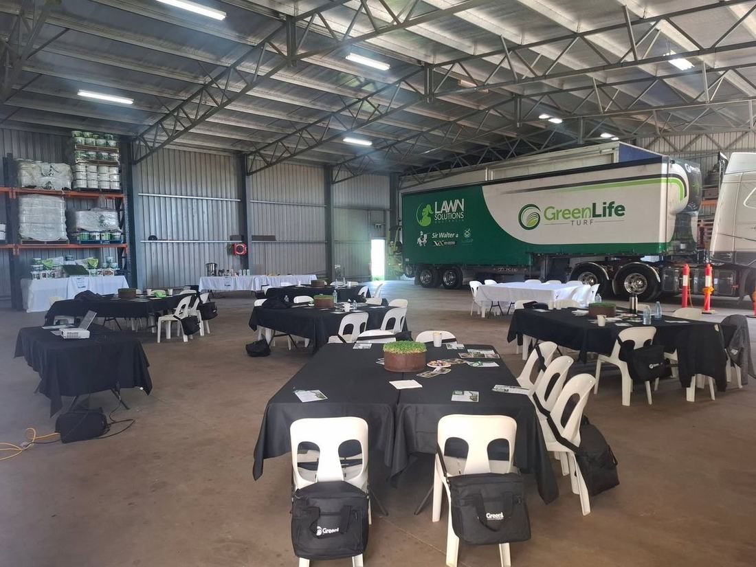Tables set for a corporate field day catered by Porkie's